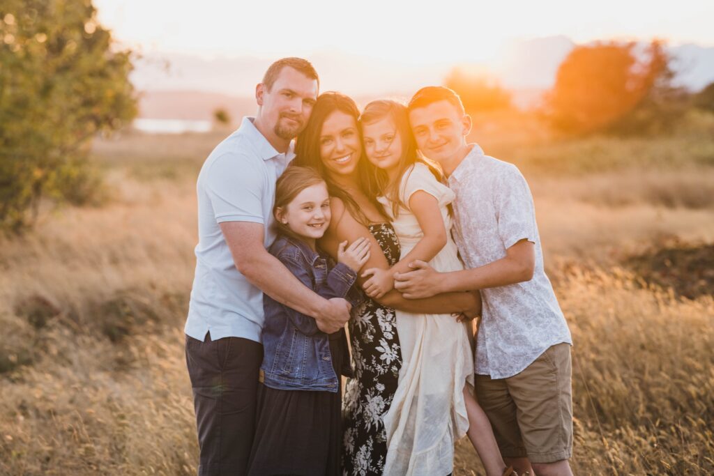 lifestyle family session with family of 5 at sunset.