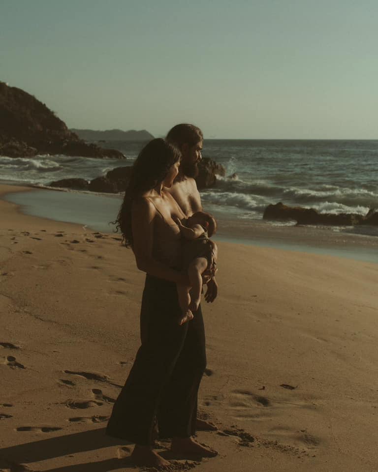 Photo of a family of 3 at the beach by Chantalle Fiscus.