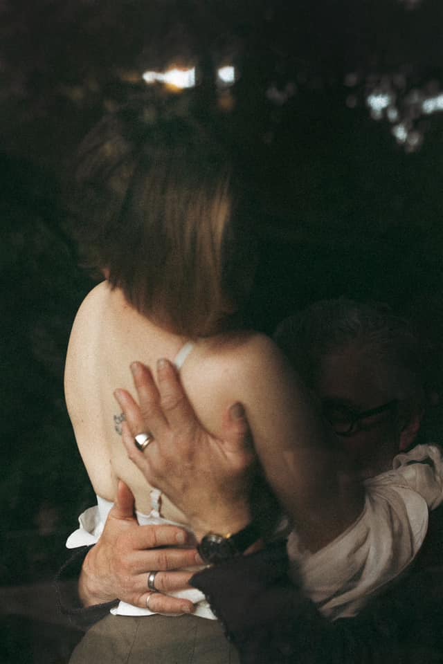 Photo of a woman and man in embrace by michelle bliss photography.