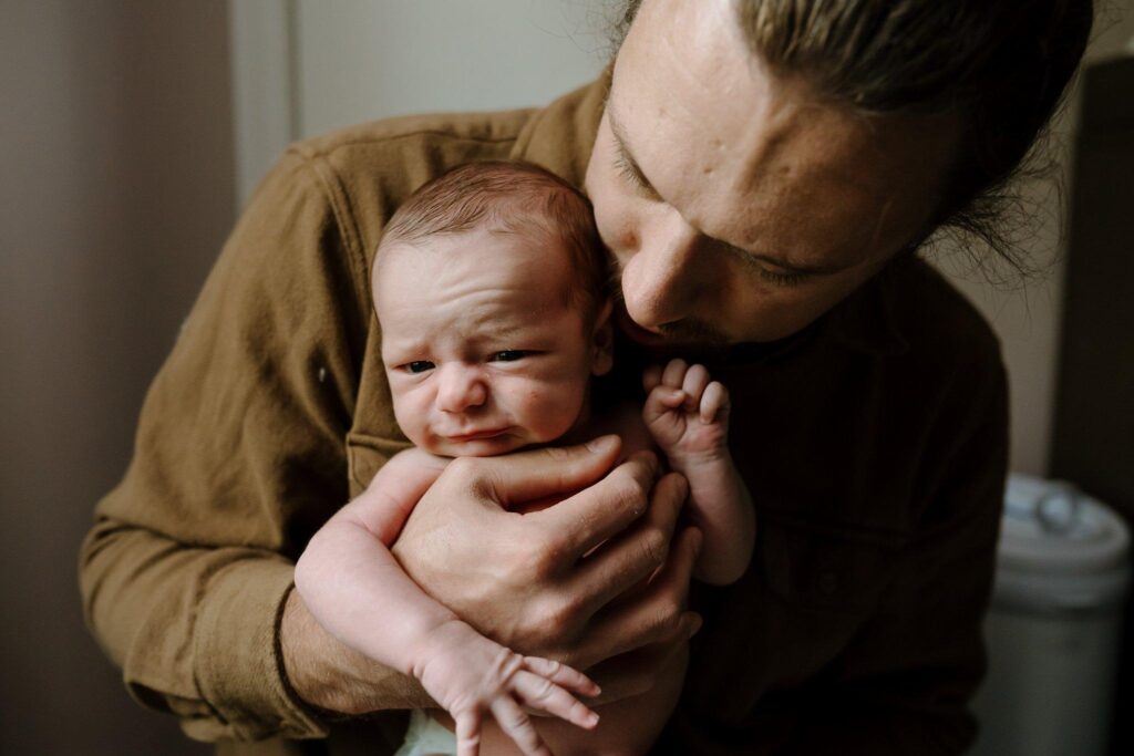 Lifestyle photographer capturing candid fatherhood moments Susannah Treadway.