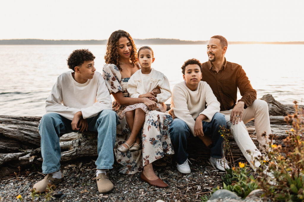 Close up shot of a family of five showing visual triangles and physical connection in large family photography.