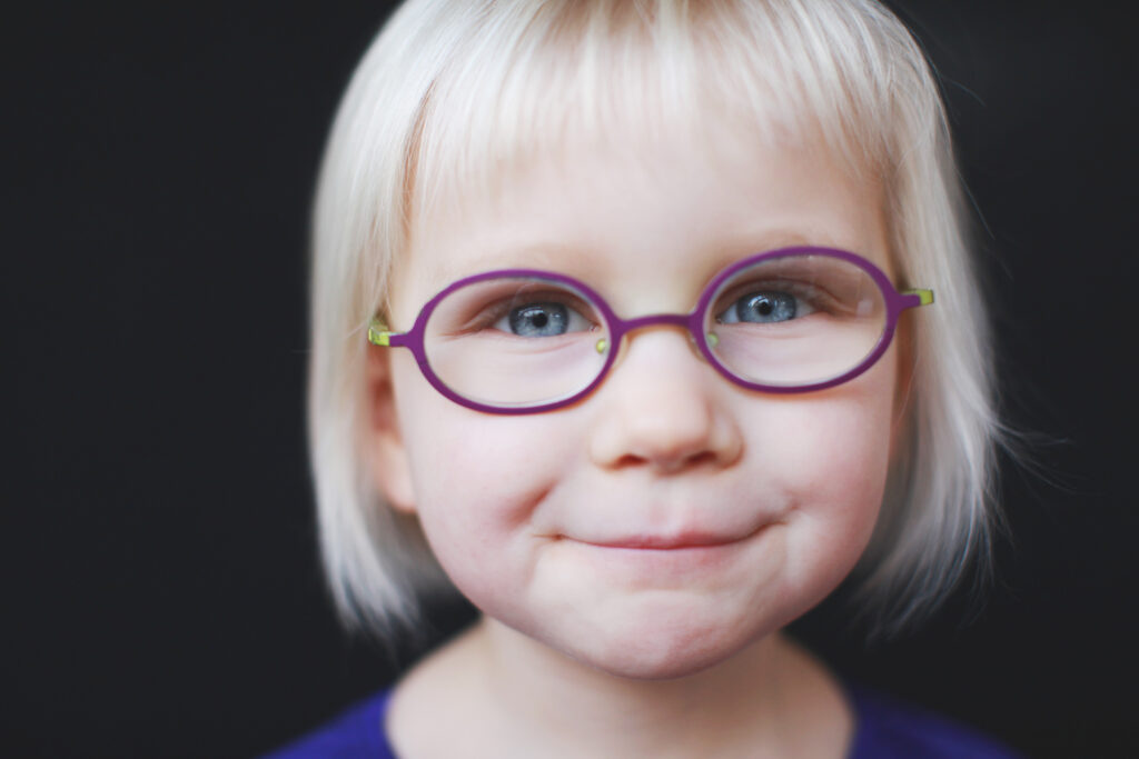 A happy student showing real expressions captured during a high-revenue boutique school picture day.