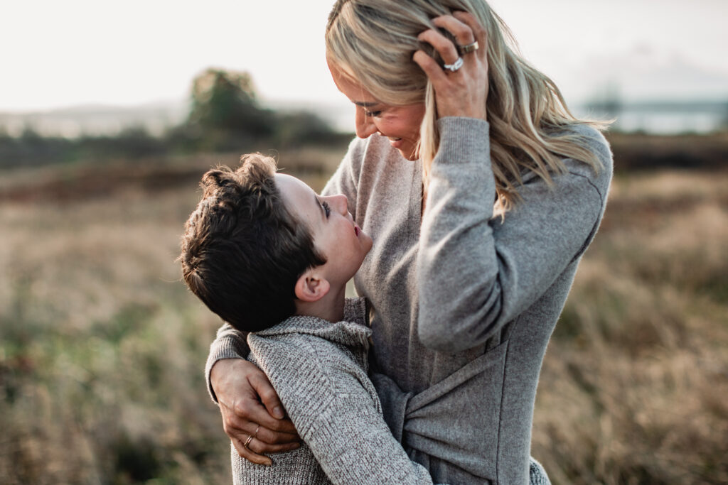 A warm, candid family portrait demonstrating the results of a strategic family photography model call with clear styling and direction.