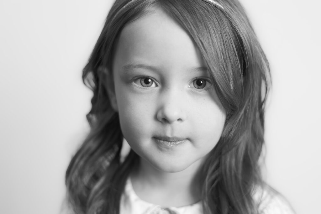 A timeless child portrait showing the boutique school photography style that attracts local preschool directors.