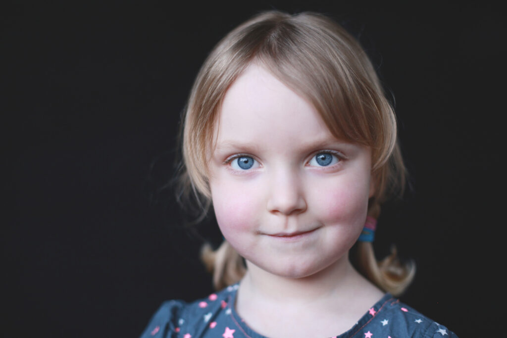 A timeless child portrait showing the boutique style used to book a preschool photography client.